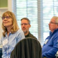 Alumni listening to the speaker.